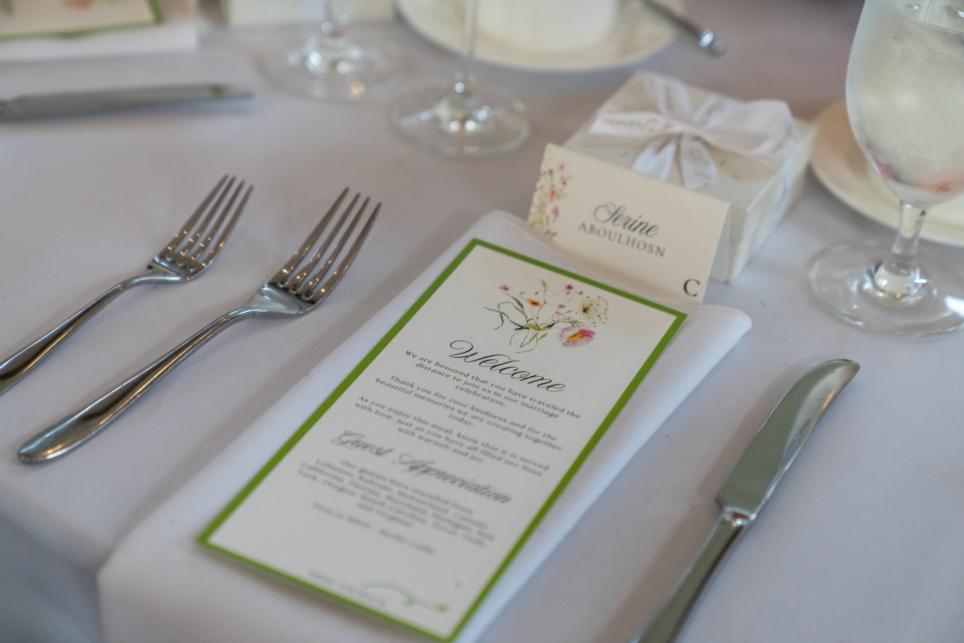 Lux Designs rentals: styled tabletop with charger, glassware and folded linen napkin