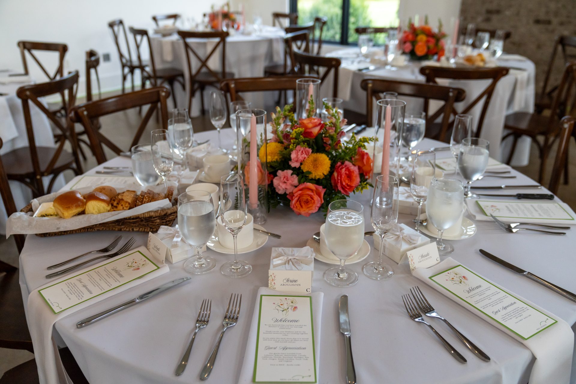 Lux Designs floral: long low garland centerpiece with taper candles on a king's table