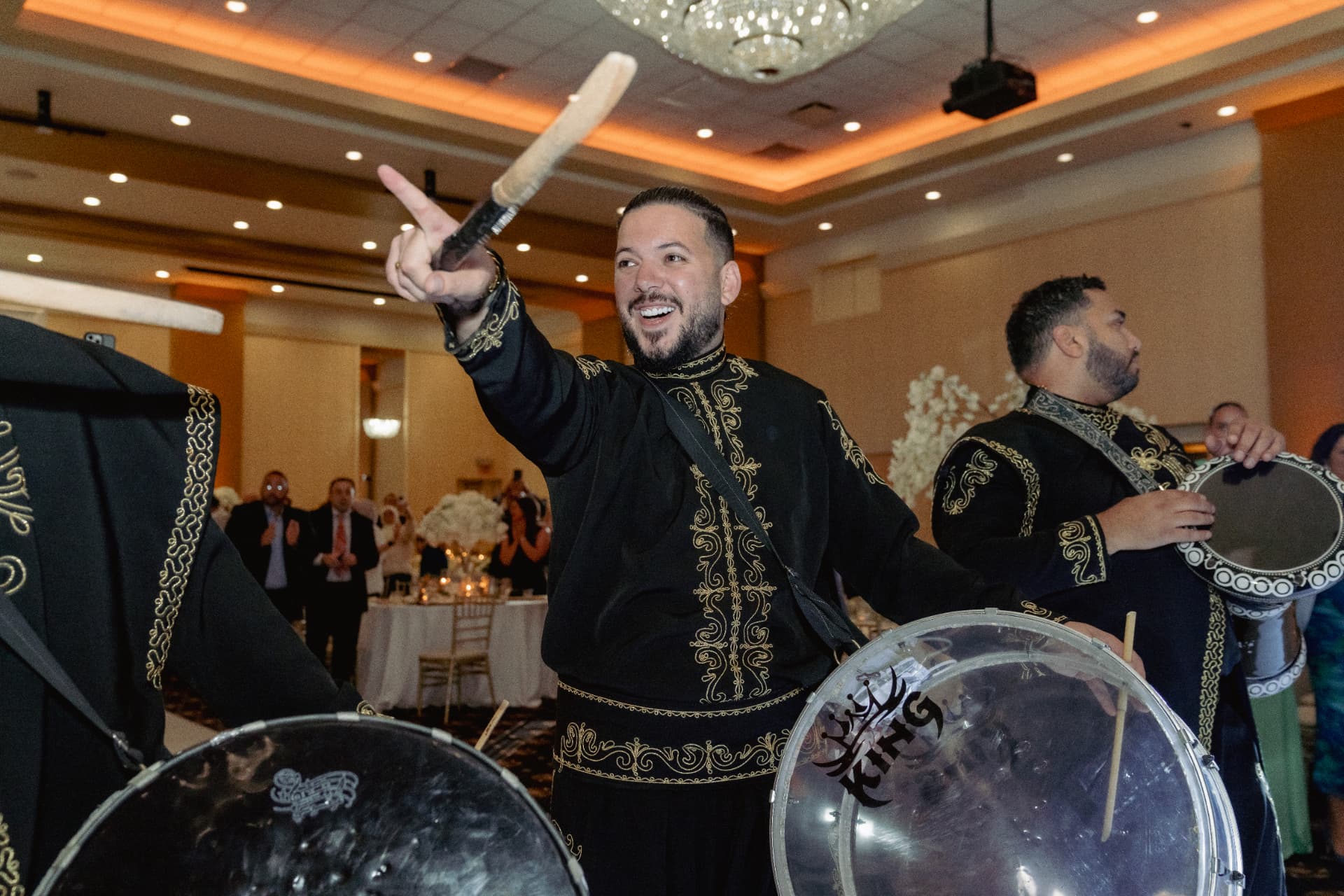 ZEO zaffa drumline performer leading with drumstick at a wedding reception