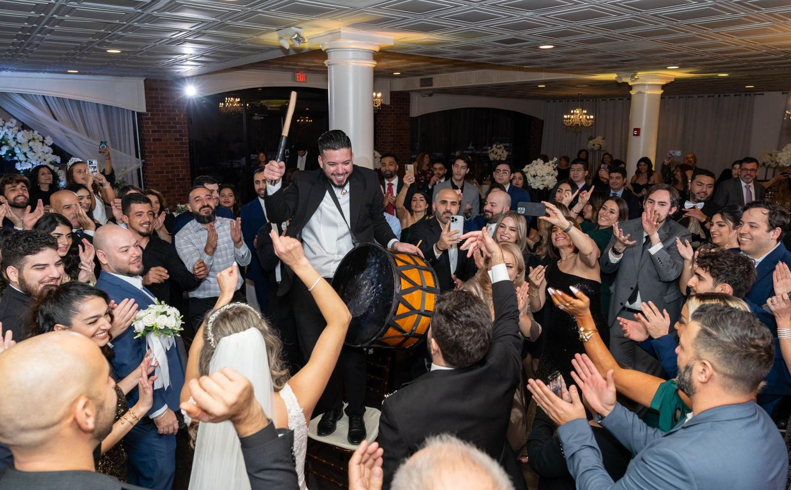 Zaffa entrance into a Georgetown hotel ballroom, drumline in dabke line