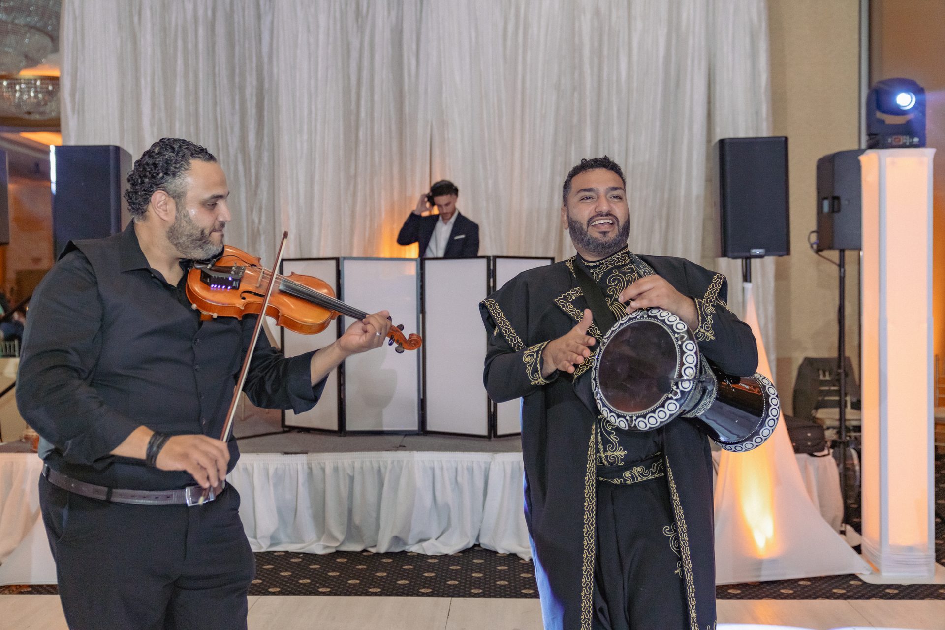 ZEO violinist and darbuka player performing together at a reception