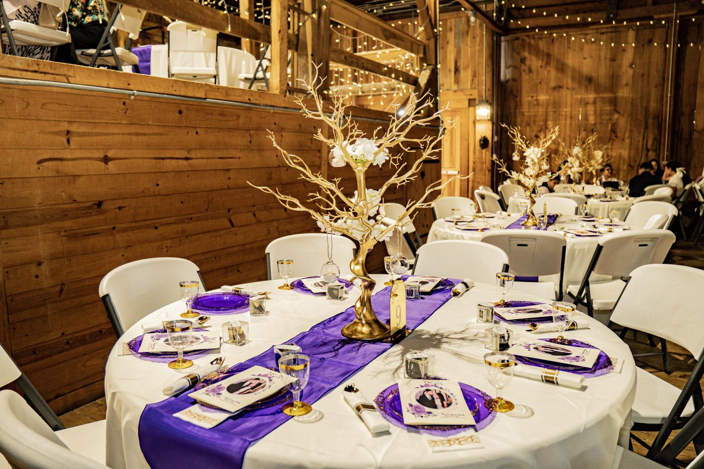 Baltimore ballroom reception with gold chargers and low centerpieces
