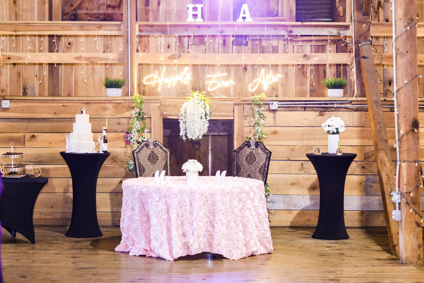 Reception under a Mayakoba palapa with hanging florals and warm string lights