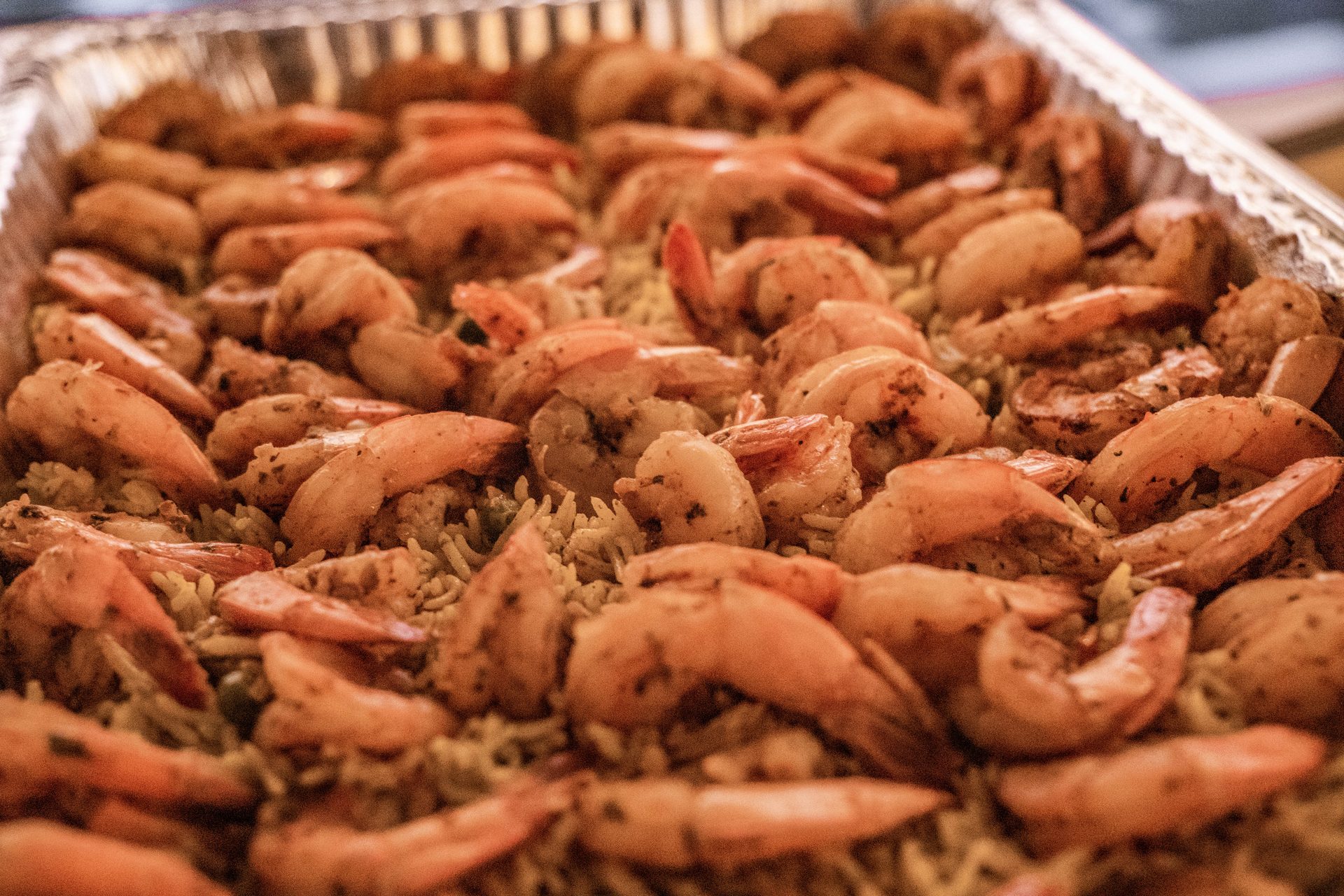 Large tray of shrimp over seasoned rice
